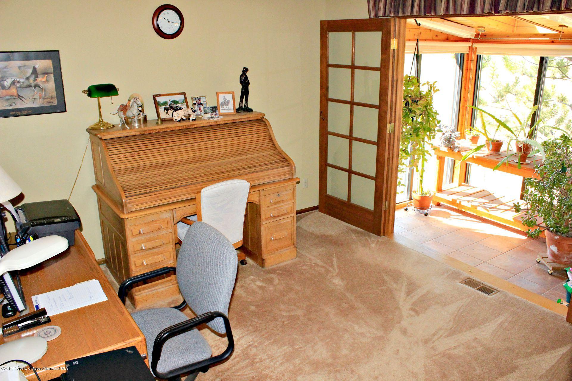 1018 County Road 294 Rifle, CO 81650 - Photo 10 of 31 a view of workspace with furniture and air conditioner