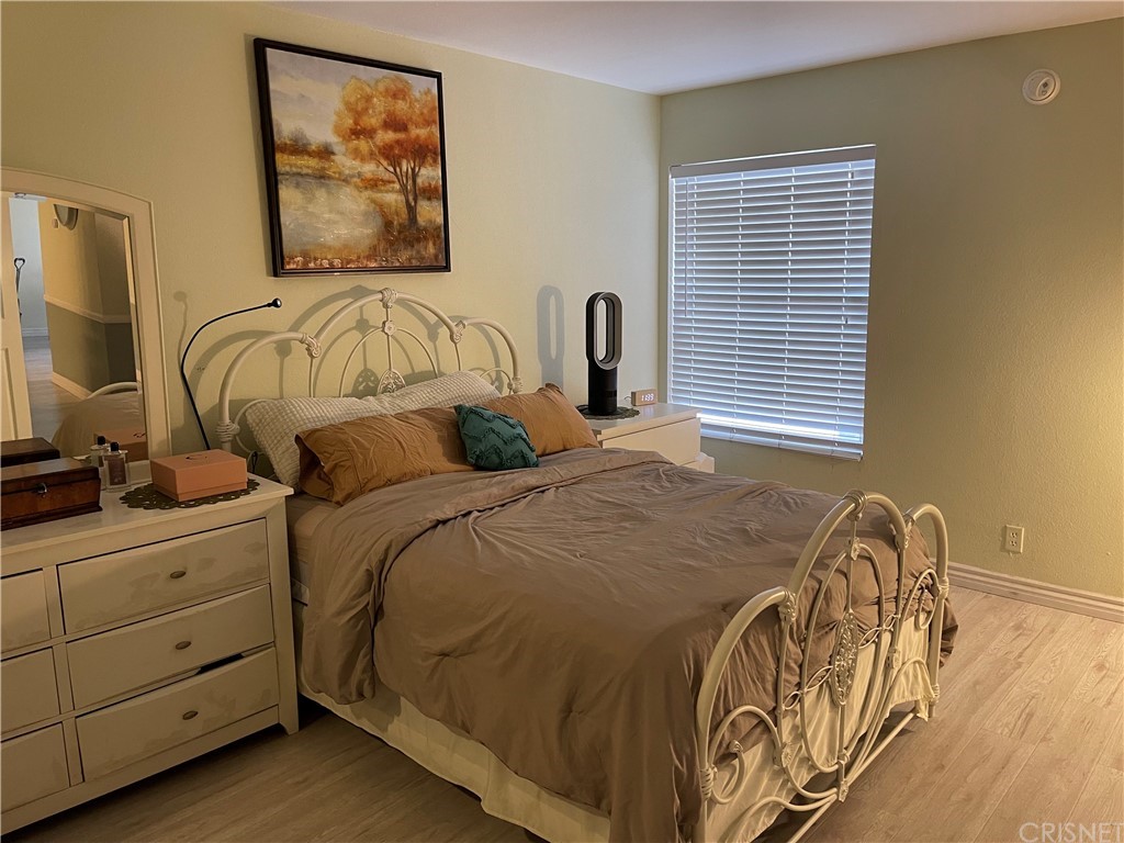 7641 Reseda Boulevard, Unit 118 Reseda, CA 91335 - Photo 10 of 16 a bedroom with a bed and a window