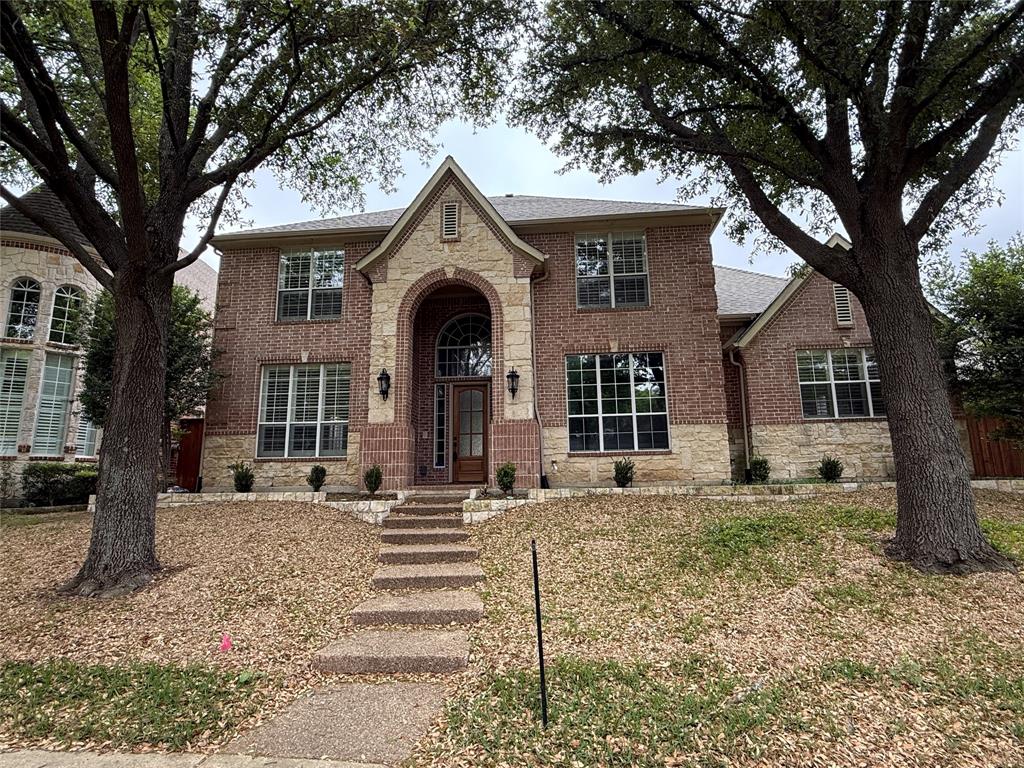 5312 Tennington Park Dallas, TX 75287 - Photo 1 of 19 a front view of a house with a tree