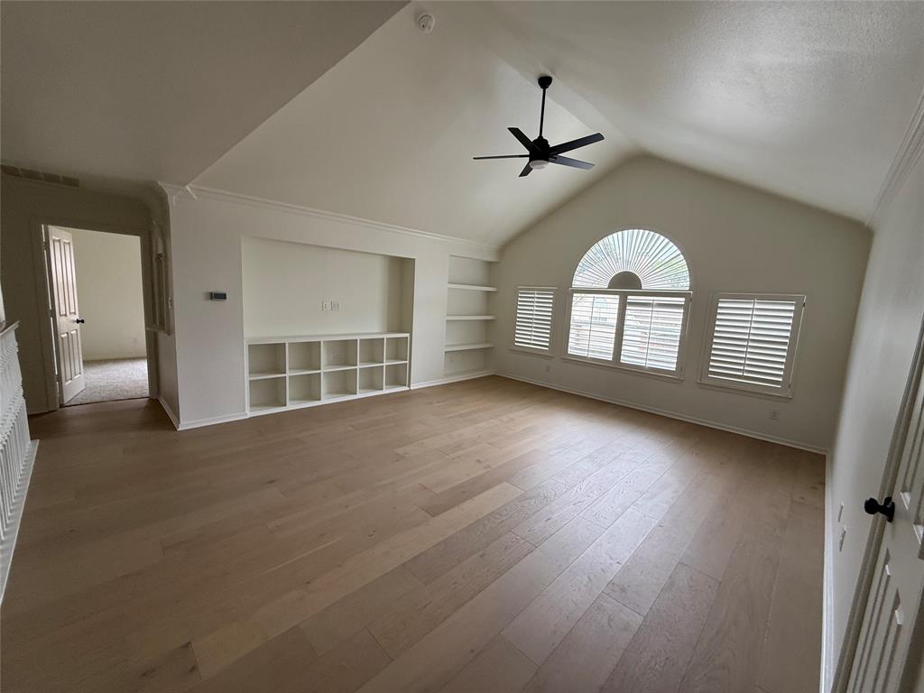 5312 Tennington Park Dallas, TX 75287 - Photo 14 of 19 an empty room with wooden floor fan and windows