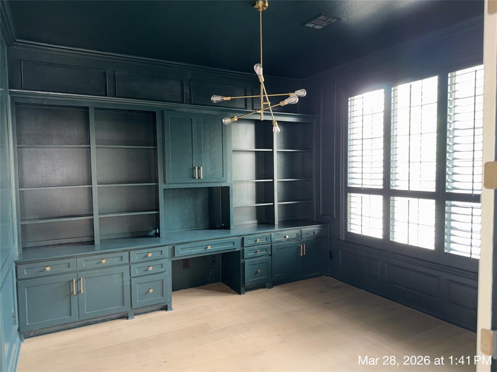5312 Tennington Park Dallas, TX 75287 - Photo 5 of 19 a kitchen with cabinets and window