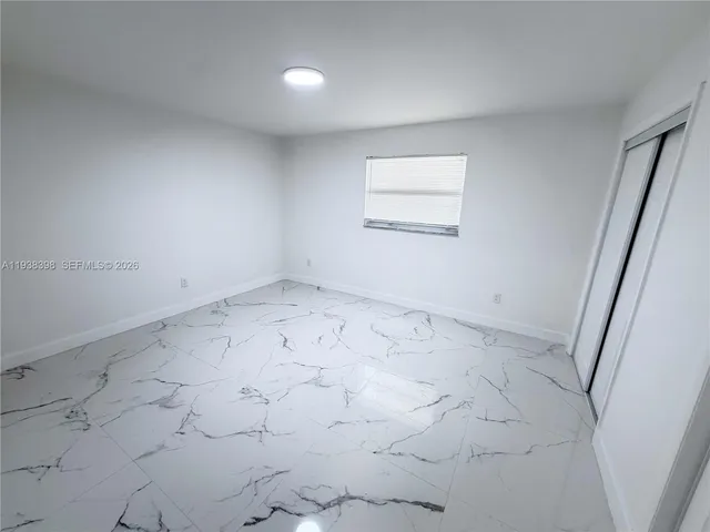 an empty room with a bench