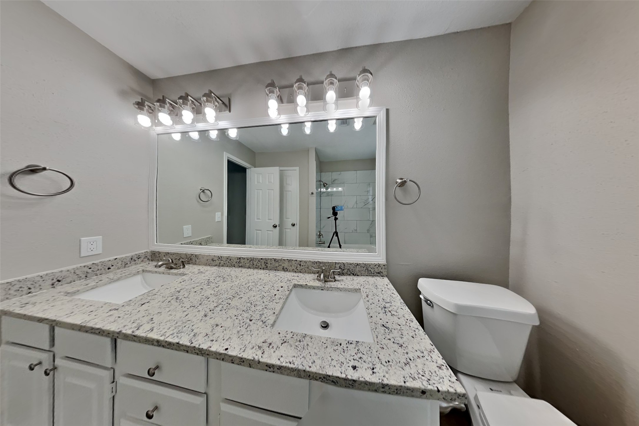 16303 Hickory Point Road Houston, TX 77095 - Photo 17 of 21 a bathroom with a granite countertop sink a toilet and a mirror