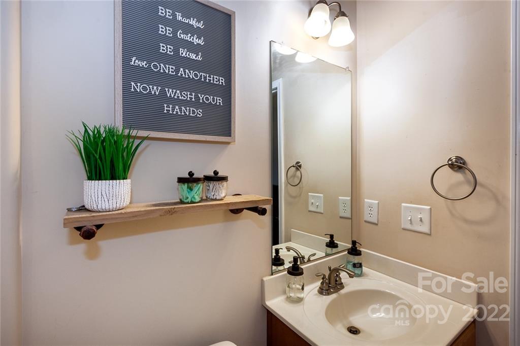 688 Winding Branch Road Rock Hill, SC 29732 - Photo 15 of 38 a bathroom with a sink and a mirror