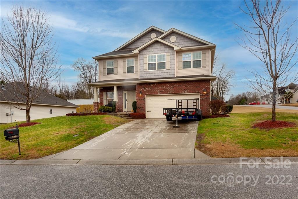 688 Winding Branch Road Rock Hill, SC 29732 - Photo 2 of 38 a view of a house with a yard and fire pit