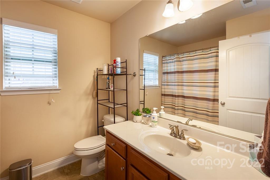 688 Winding Branch Road Rock Hill, SC 29732 - Photo 23 of 38 a bathroom with a sink toilet and mirror