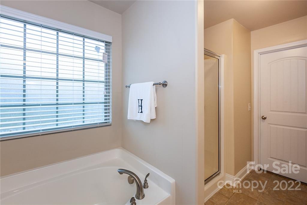 688 Winding Branch Road Rock Hill, SC 29732 - Photo 24 of 38 a bathroom with a bathtub and a window