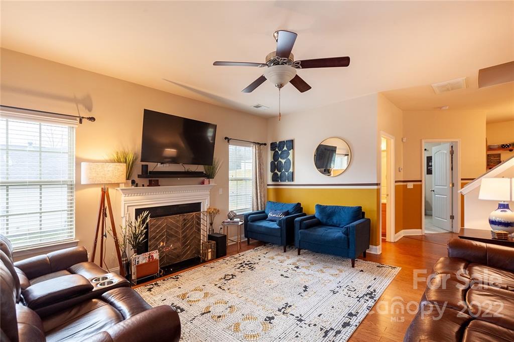 688 Winding Branch Road Rock Hill, SC 29732 - Photo 7 of 38 a living room with furniture flat screen tv and a fireplace