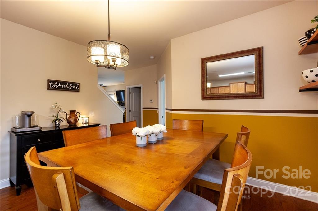 688 Winding Branch Road Rock Hill, SC 29732 - Photo 10 of 38 a view of a dining room with furniture and wooden floor