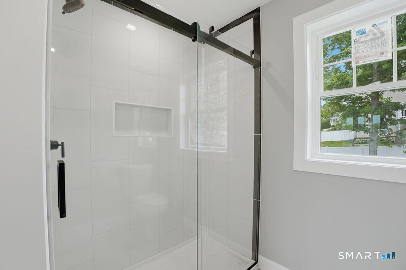 796 Maple Hill Road Naugatuck, CT 06770 - Photo 25 of 35 a bathroom with a glass shower door
