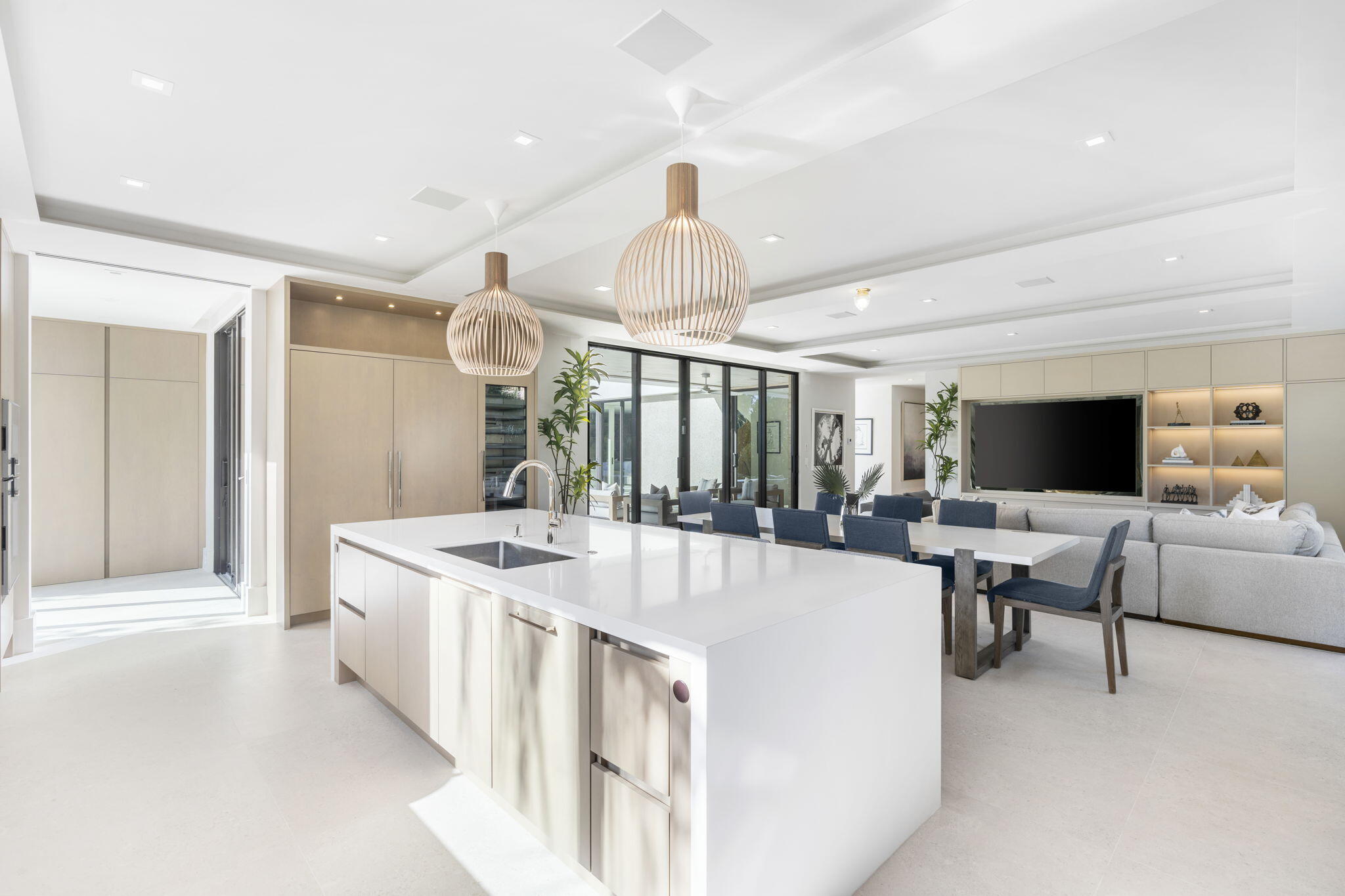 2291 Ibis Isle Road East Palm Beach, FL 33480 - Photo 11 of 32 a large white kitchen with a large island in it