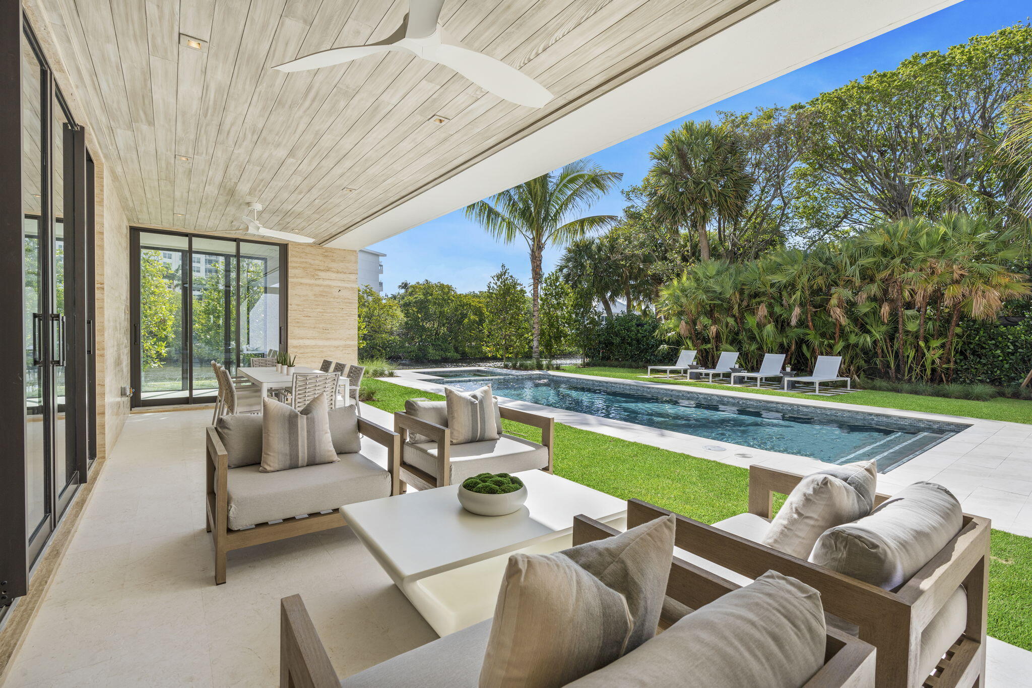 2291 Ibis Isle Road East Palm Beach, FL 33480 - Photo 12 of 32 a view of swimming pool with outdoor seating and couches