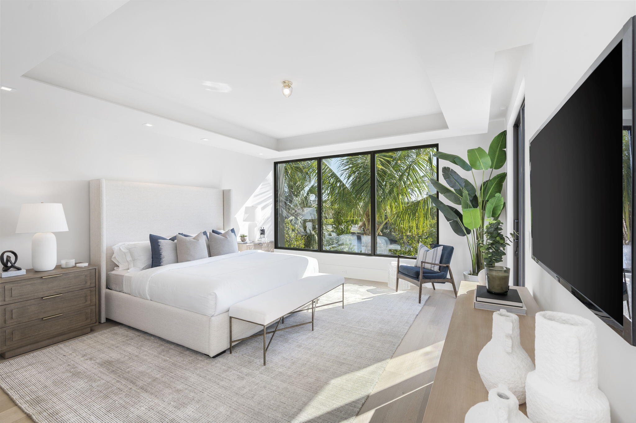 2291 Ibis Isle Road East Palm Beach, FL 33480 - Photo 14 of 32 a bed room with a bed and a large window