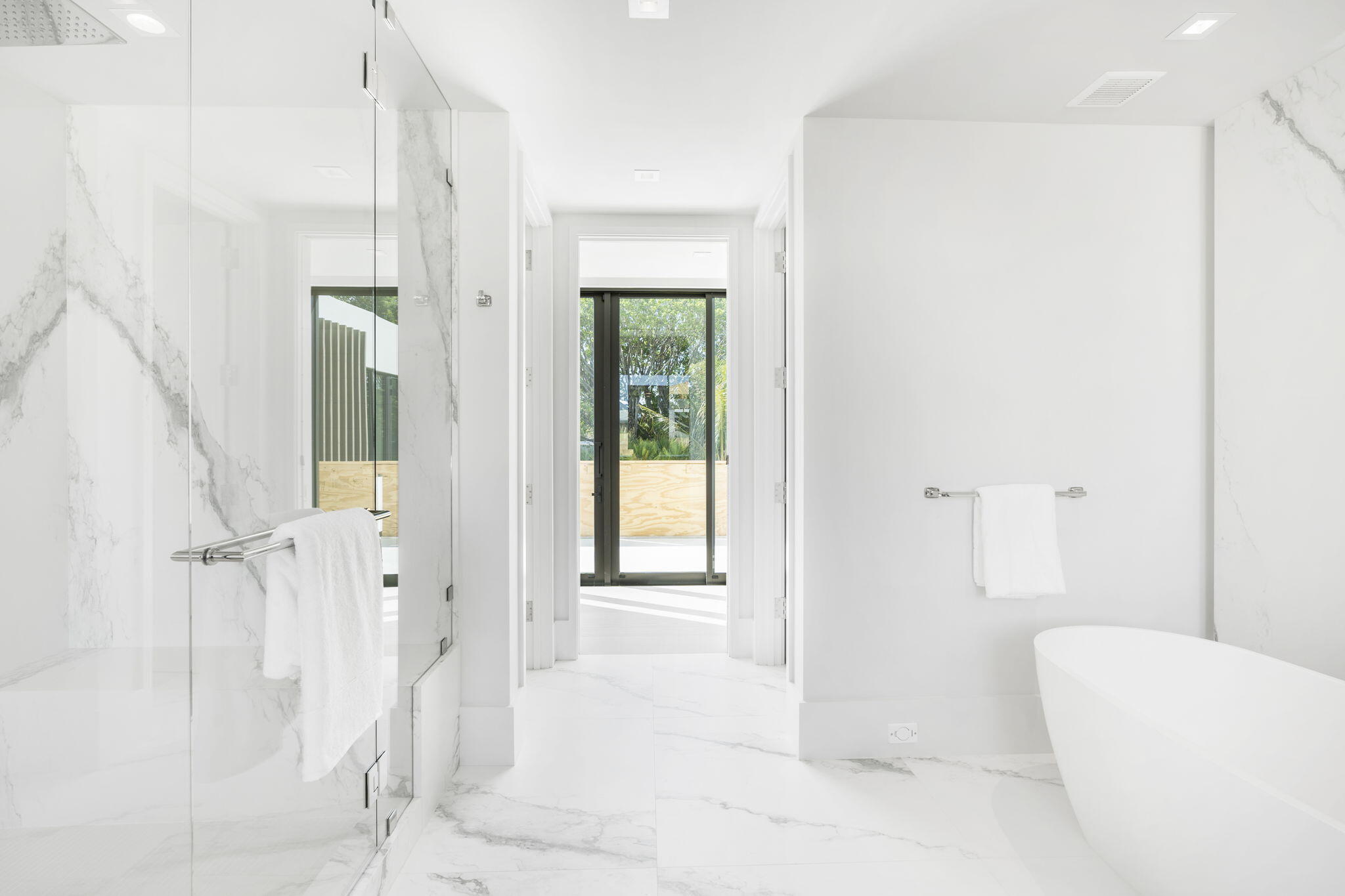 2291 Ibis Isle Road East Palm Beach, FL 33480 - Photo 16 of 32 a bathroom with a bathtub and a shower