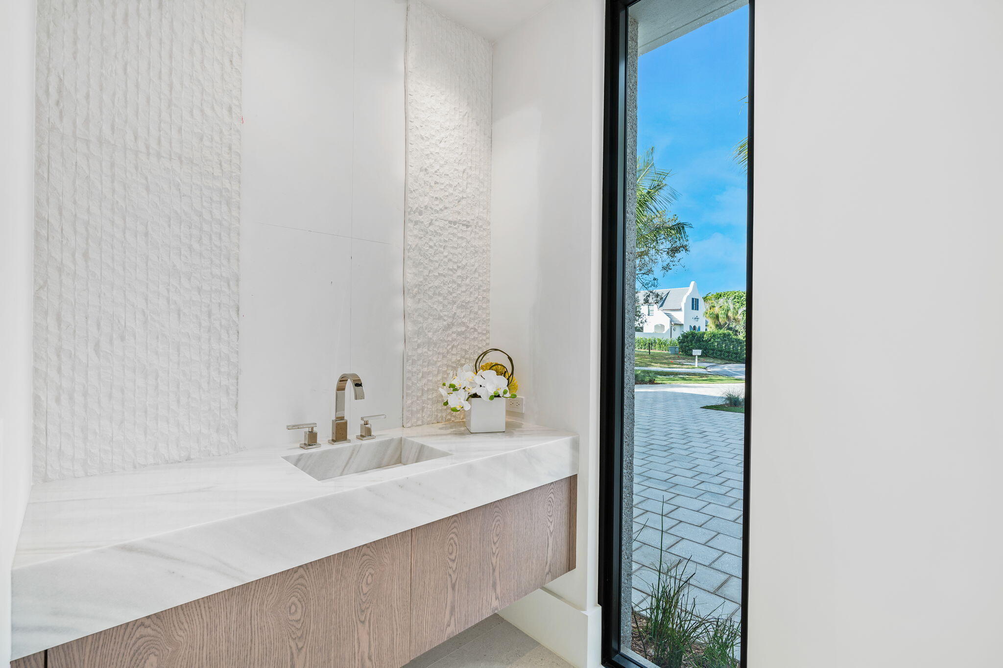 2291 Ibis Isle Road East Palm Beach, FL 33480 - Photo 22 of 32 a bathroom with a sink and a mirror