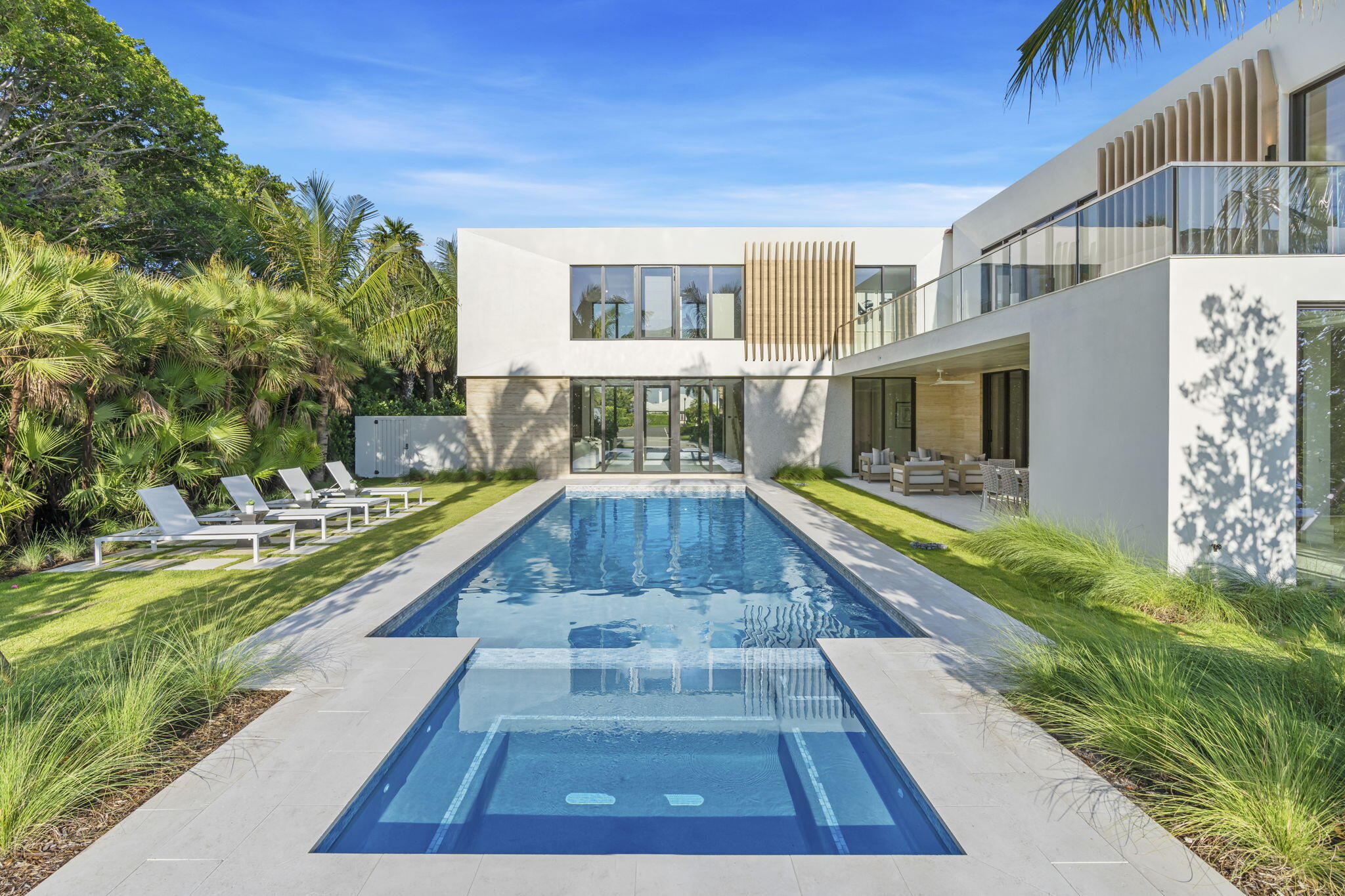 2291 Ibis Isle Road East Palm Beach, FL 33480 - Photo 4 of 32 a view of swimming pool with a garden and plants