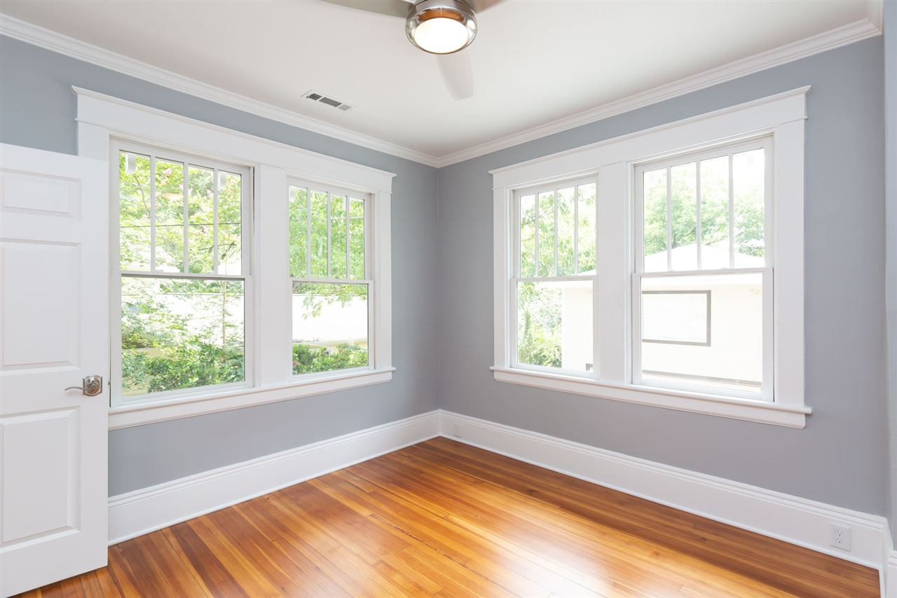1607 Scales Street Raleigh, NC 27608 - Photo 18 of 27 a view of an empty room with wooden floor and a window