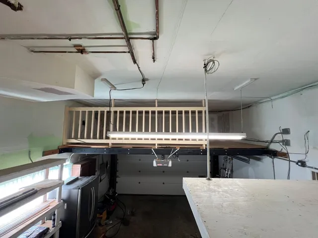 a kitchen with a sink a stove and chairs