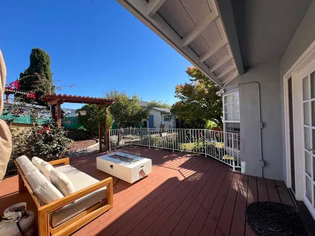 a view of a backyard with a tree