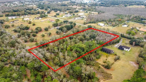 an aerial view of swimming pool and outdoor space