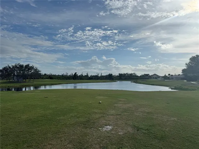 a view of a lake with a big yard
