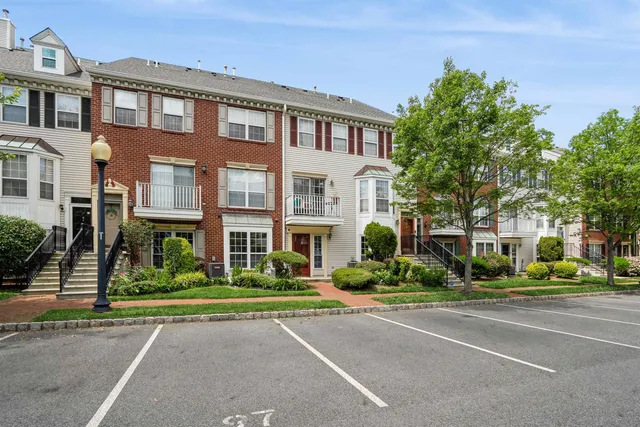 a front view of a building and a yard