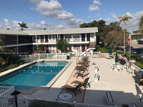 a view of a swimming pool with a patio