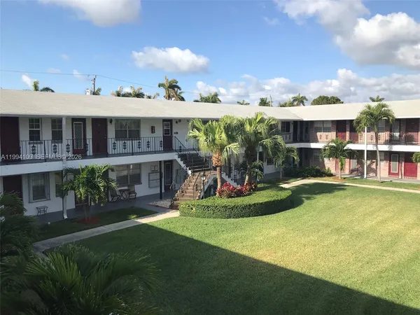 a view of a house with a yard patio and a patio