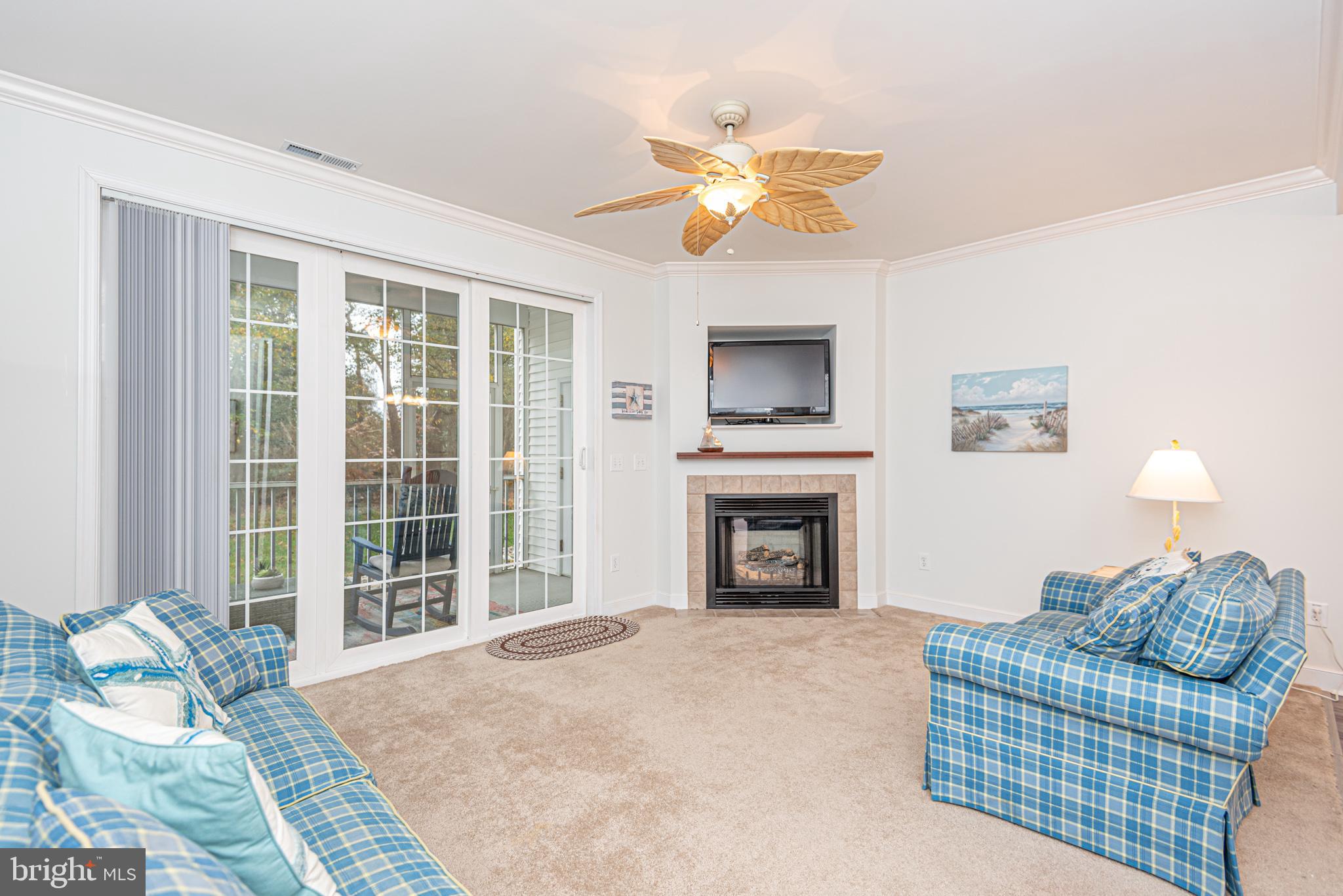 30611 Cedar Neck Road, Unit 2103 Ocean View, DE 19970 - Photo 11 of 44 Slider to back screened porch