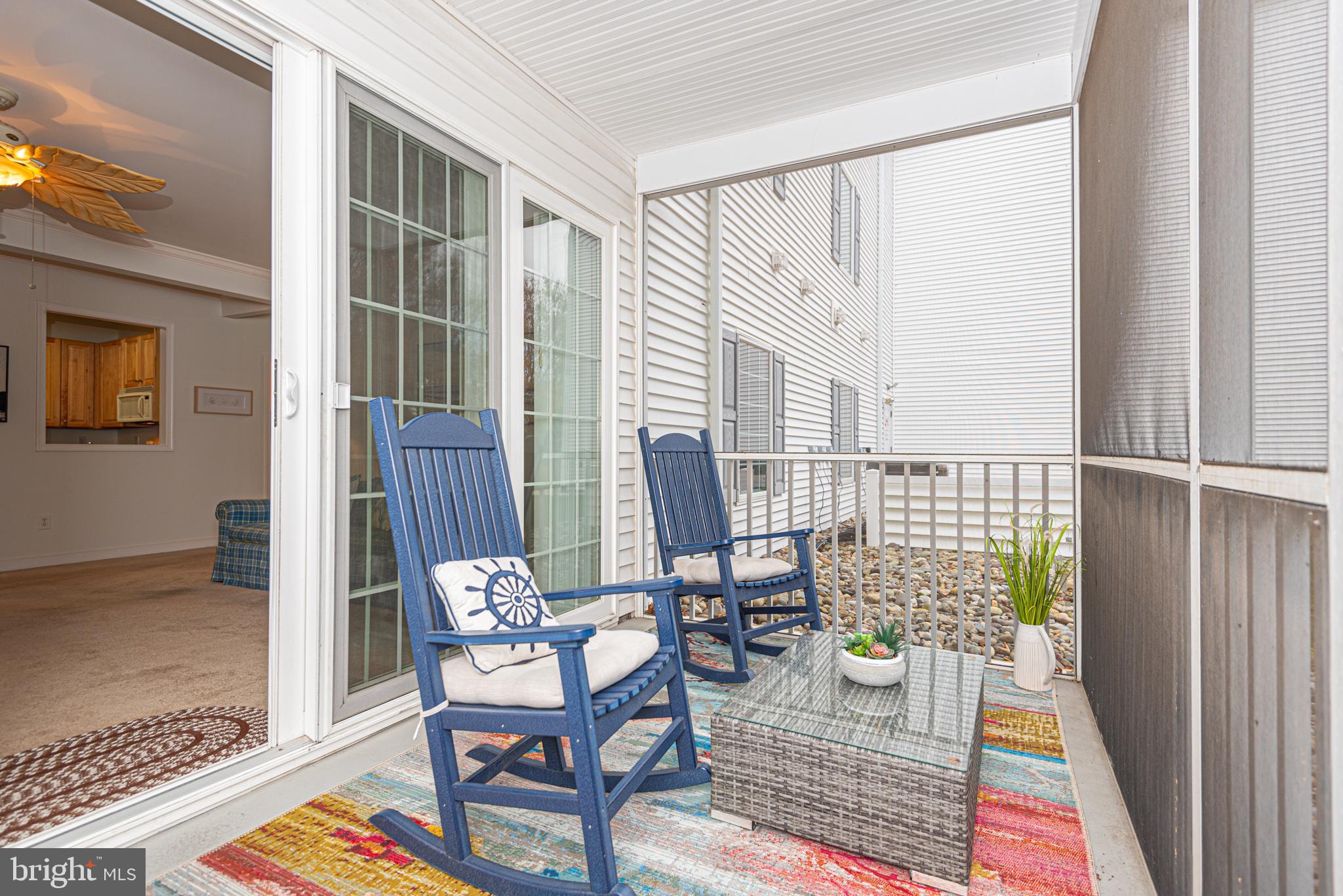 30611 Cedar Neck Road, Unit 2103 Ocean View, DE 19970 - Photo 16 of 44 Relax on the screened porch