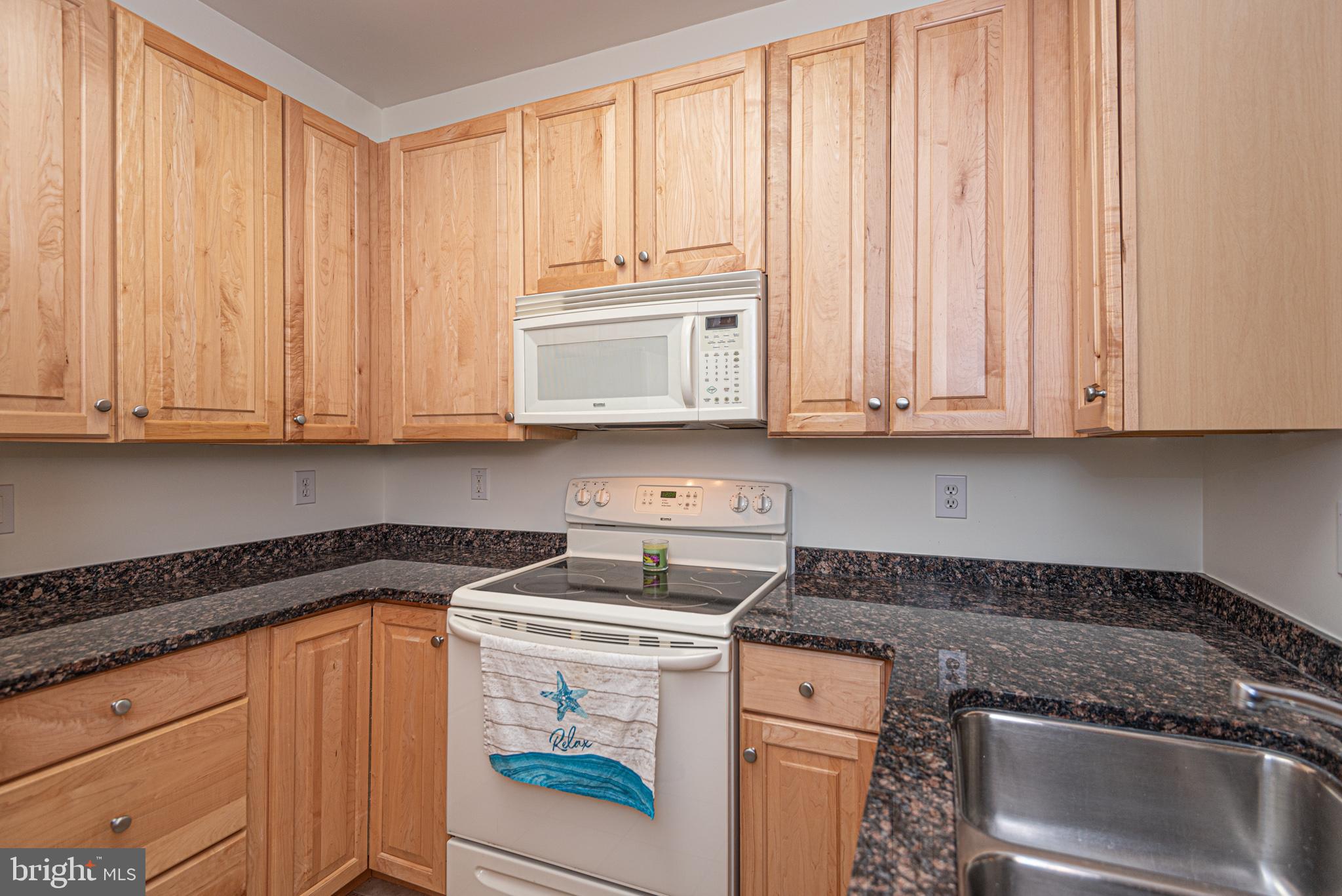 30611 Cedar Neck Road, Unit 2103 Ocean View, DE 19970 - Photo 7 of 44 Kitchen with granite counters