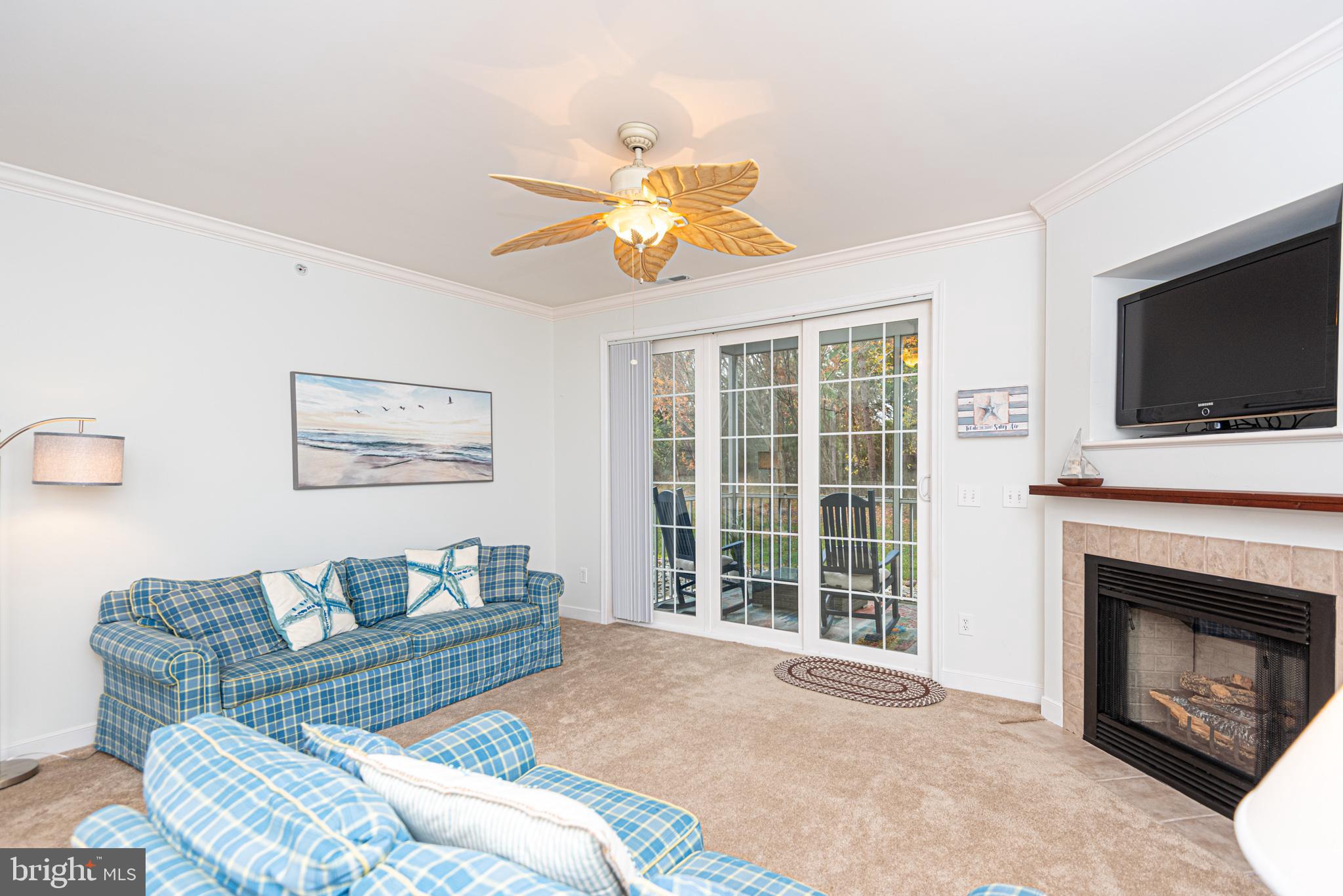 30611 Cedar Neck Road, Unit 2103 Ocean View, DE 19970 - Photo 9 of 44 Great room with fireplace