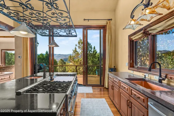 a kitchen with a sink and wooden cabinets