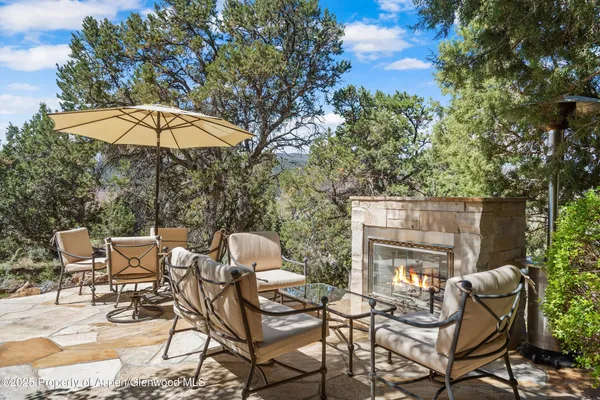 a patio with a yard table and chairs