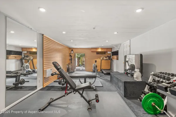 a workspace with furniture and a gym