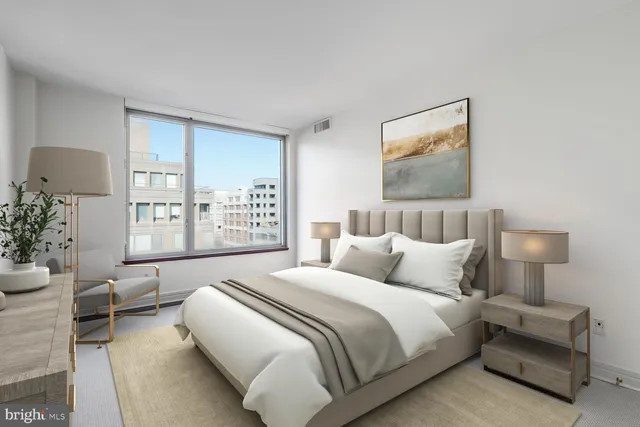 a bedroom with bed and a night stand