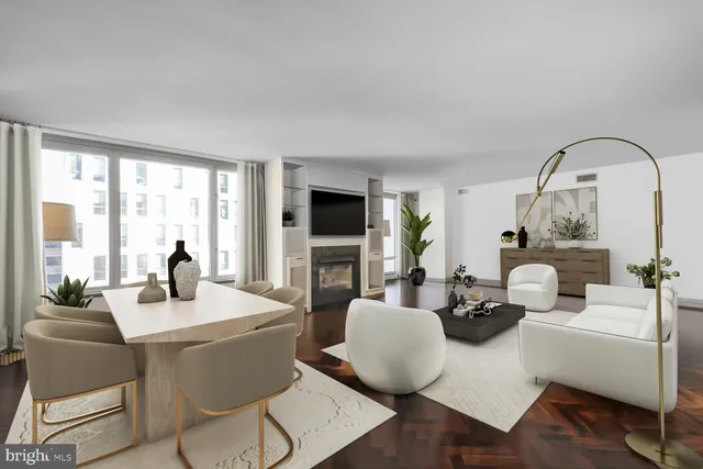 a living room with furniture a flat screen tv and a large window