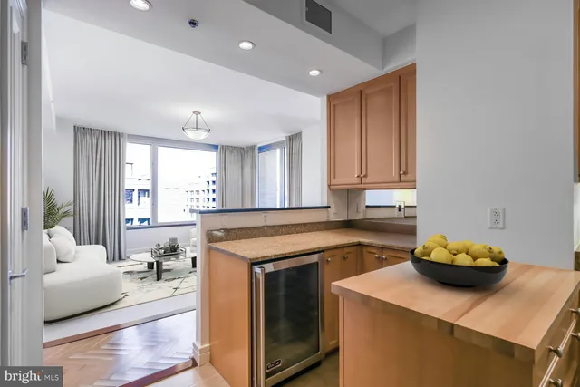 a kitchen with a sink a stove and cabinets