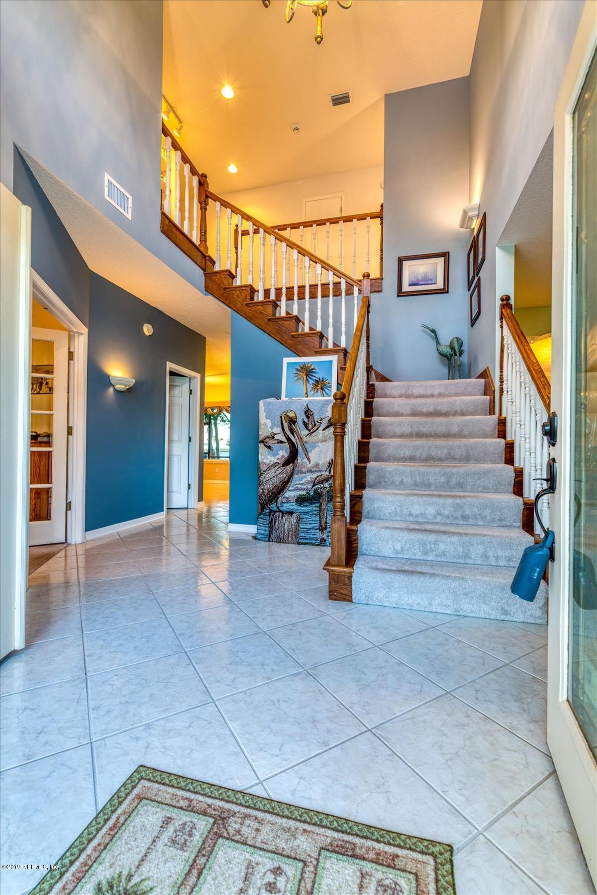 16125 Shellcracker Road Jacksonville, FL 32226 - Photo 4 of 31 a view of staircase with furniture and stairs