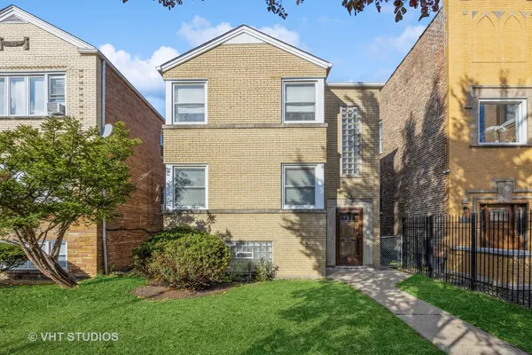 front view of a house with a yard