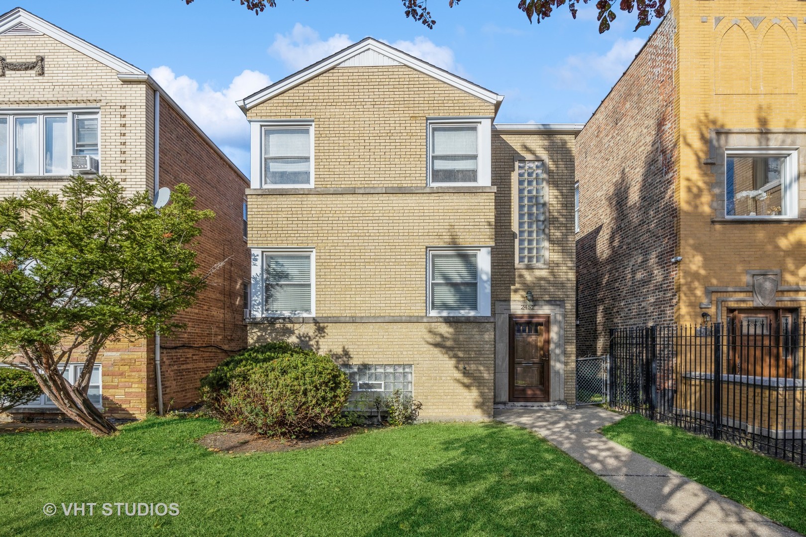 2452 West Marquette Road Chicago, IL 60629 - Photo 2 of 11 front view of a house with a yard