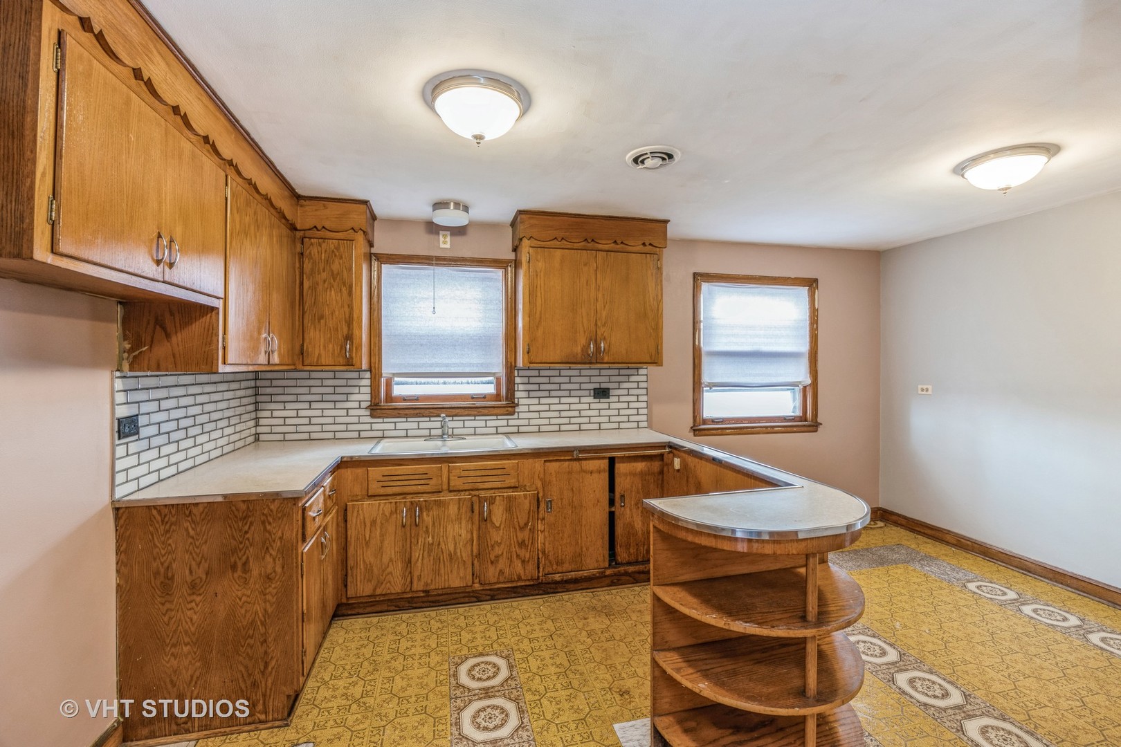 2452 West Marquette Road Chicago, IL 60629 - Photo 8 of 11 a kitchen with a sink and a stove top oven