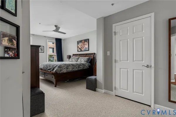 a bathroom with a granite countertop double vanity sink and mirror