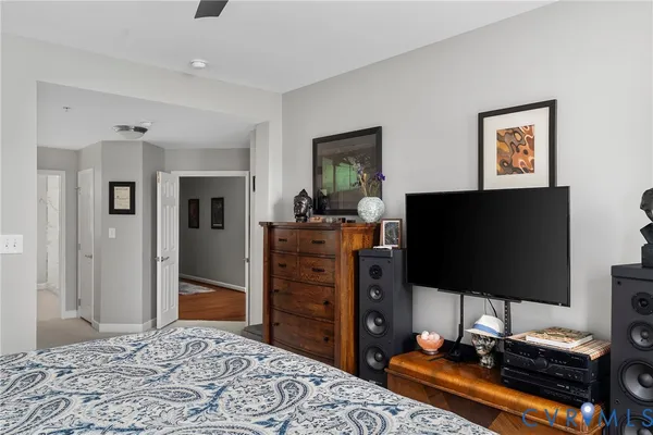a living room with furniture a window and potted plants