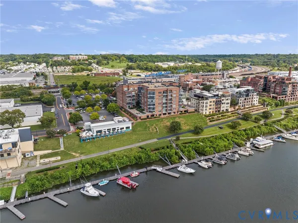 a view of a brick building next to a yard