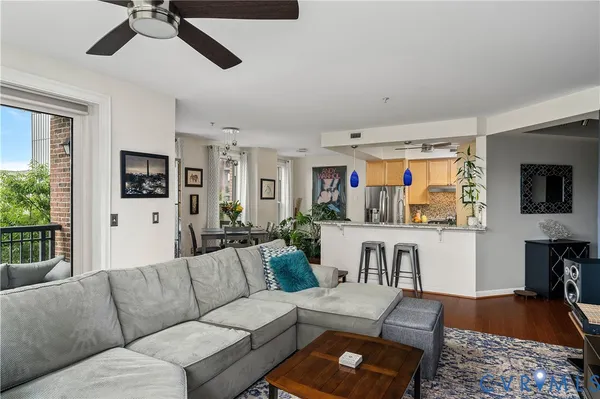 a kitchen with granite countertop a refrigerator and a sink