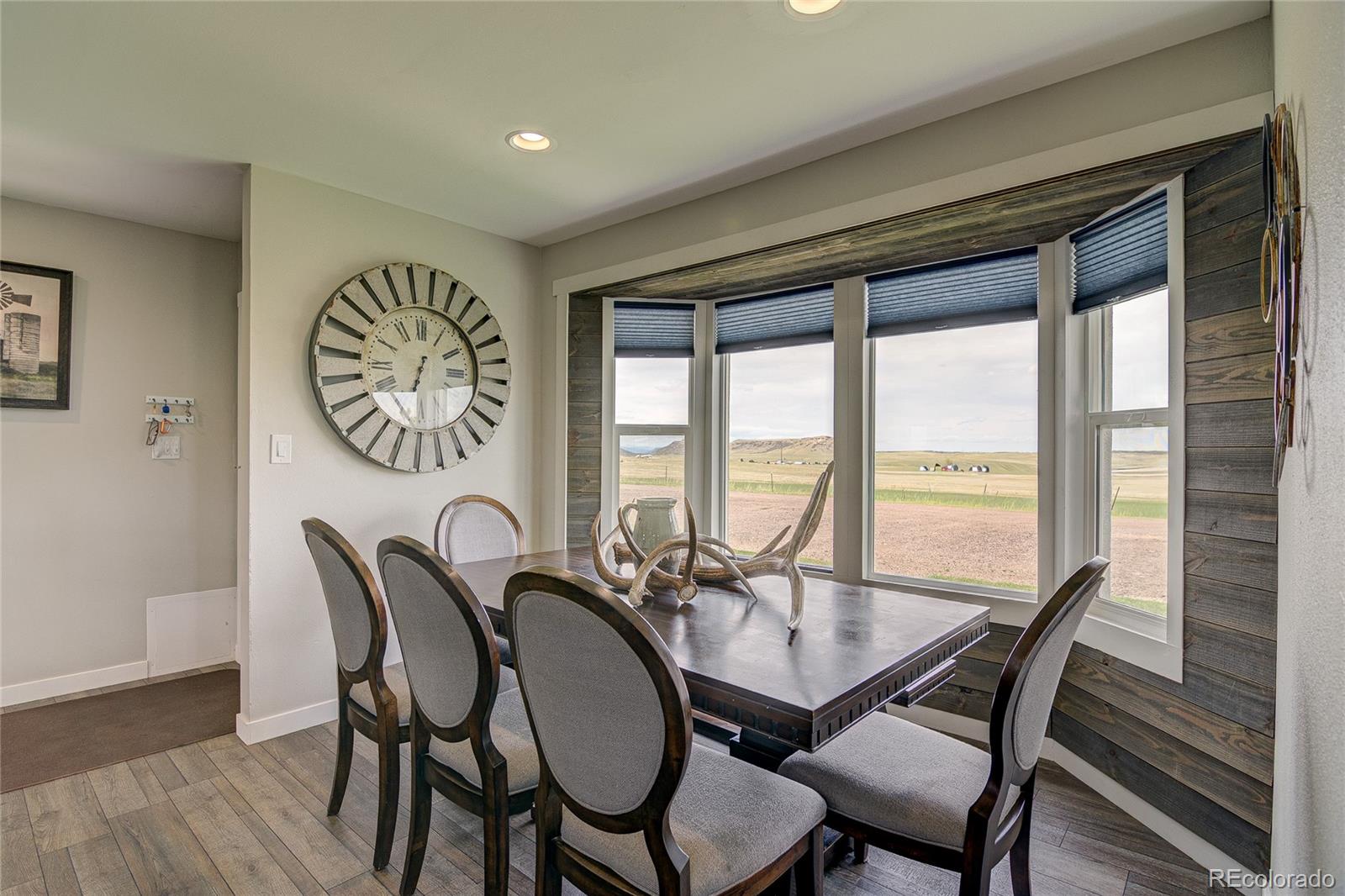 4531 East Best Road Larkspur, CO 80118 - Photo 10 of 49 a view of a dining room with furniture window and outside view