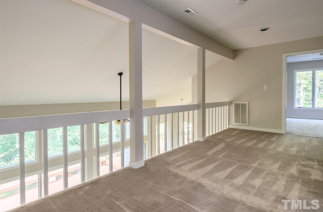 10501 New Arden Way Raleigh, NC 27613 - Photo 16 of 28 Filled with light loft. Path to upstairs bedrooms and bath