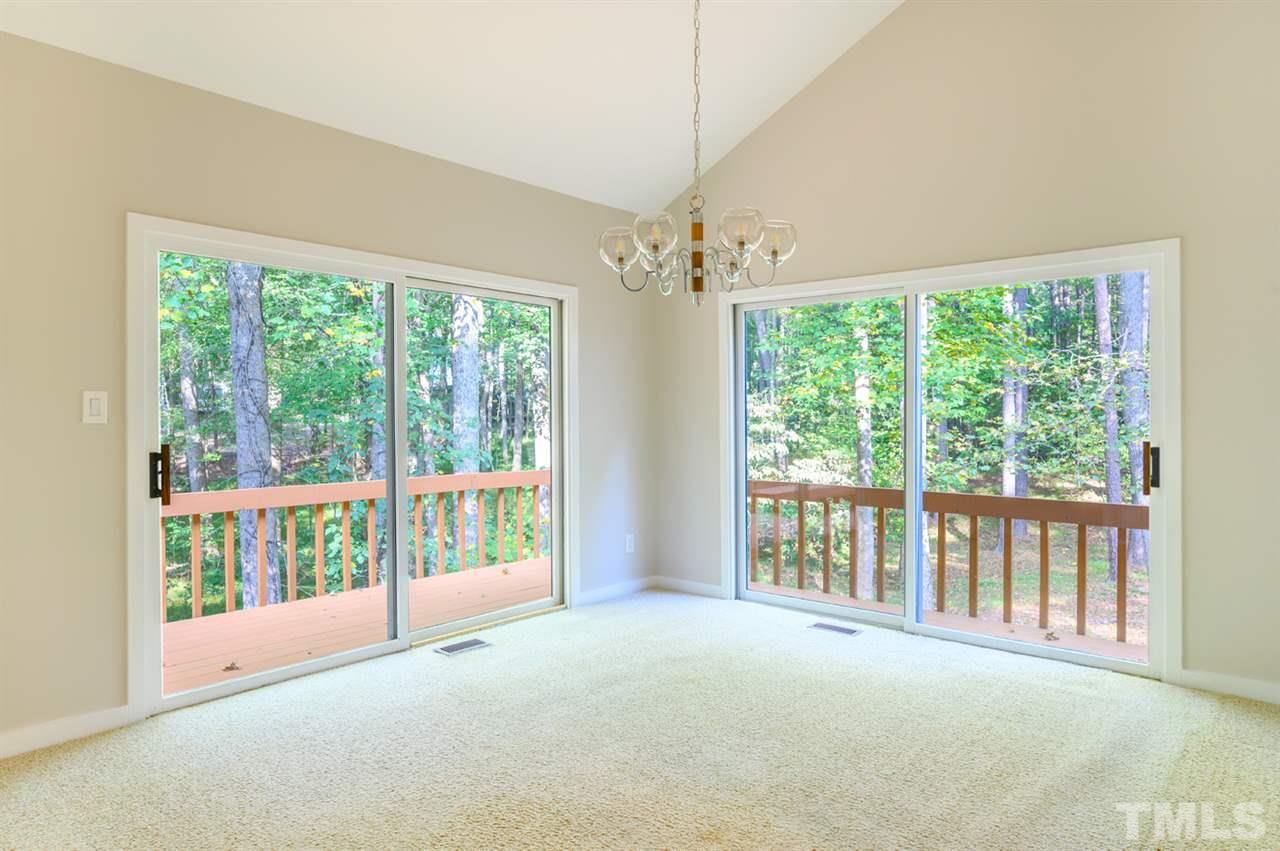 10501 New Arden Way Raleigh, NC 27613 - Photo 9 of 28 Dining room with lots of light and great views