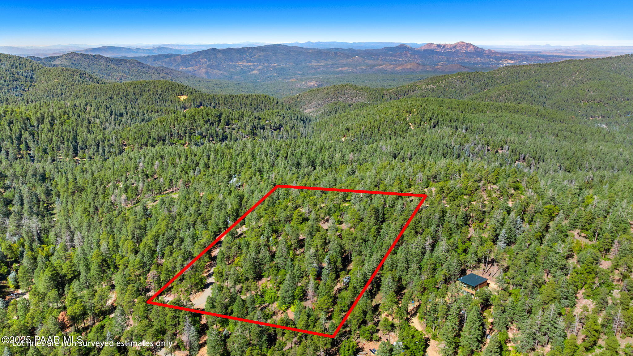 318 East Poland Road Prescott, AZ 86303 - Photo 25 of 28 a view of a lush green hillside and a building